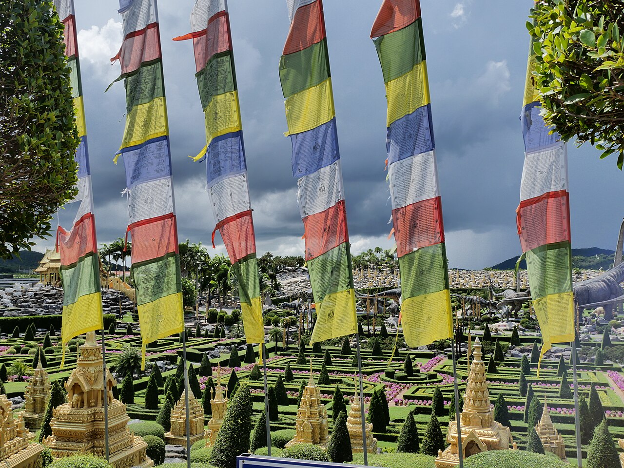 A Bhutanese-themed garden area at Nong Nooch Pattaya, decorated with colourful prayer flags
