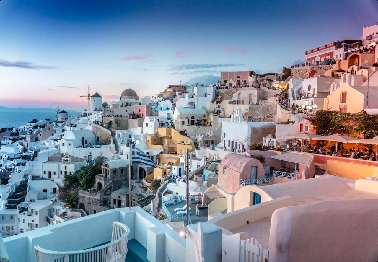 White-washed houses with blue domed roofs on Santorini island, Greece