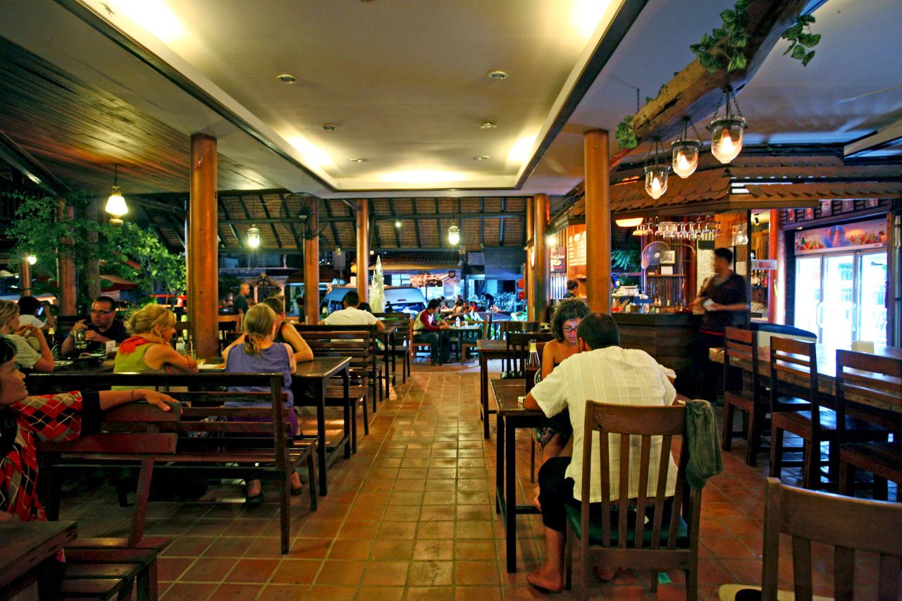 On-site guesthouse restaurant with terracotta-tiled floor