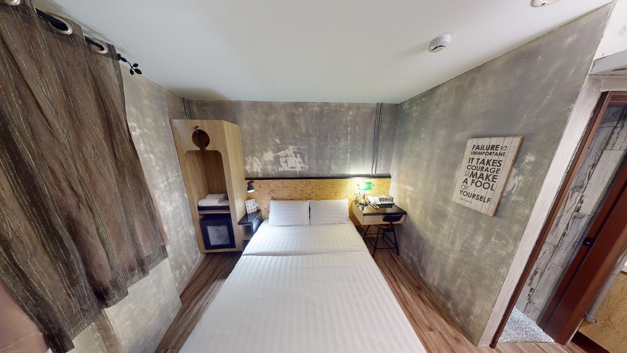 พื้นที่ส่วนกลางสไตล์อินดัสเทรียลของ Beimen WOW Poshtel